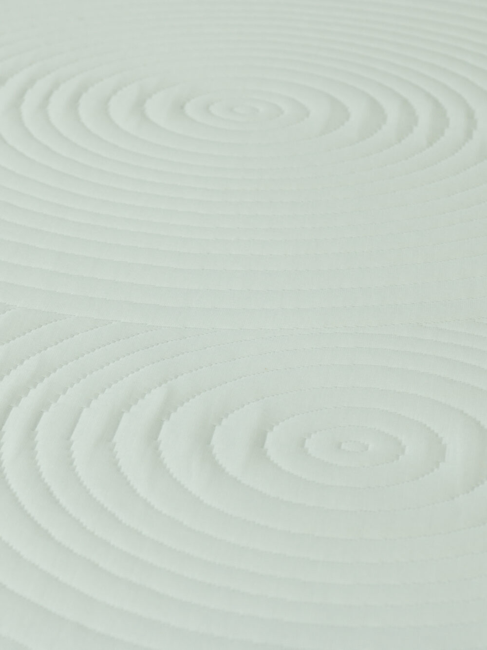 Capa de colchão em tecido texturizado da marca LeCamaleon